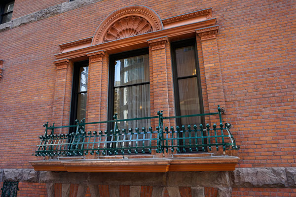 York Street balconettes were rebuilt matching the originals removed in the 1970s, with restored 1980s-era ironwork painted in the original 1880s green. The terra cotta decoration was taken down, internally reinforced and flashed in lead.