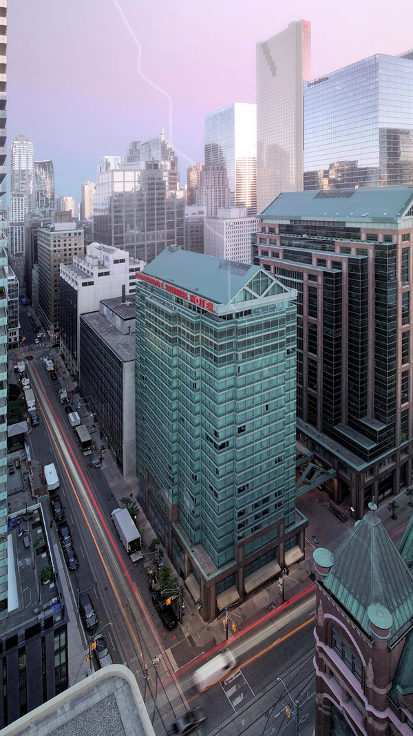 A new residential lobby with access from Victoria Street is proposed for the Cambridge Suites Hotel revamp, connecting to a driveway shared by the adjacent GWL office building. Pictured is the existing building.