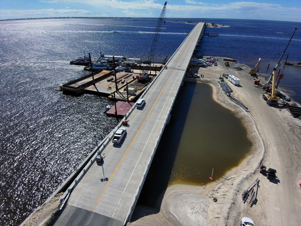 Crews used 8,200 loads of dirt, 2,400 loads of rock, and 4,000 tons of asphalt to make emergency repairs. Dive teams with underwater survey equipment were called in to assess damage to the structure. Seventy pieces of heavy equipment were operating daily, along with four barges, seven cranes, two dredges, five boats and dump trucks.