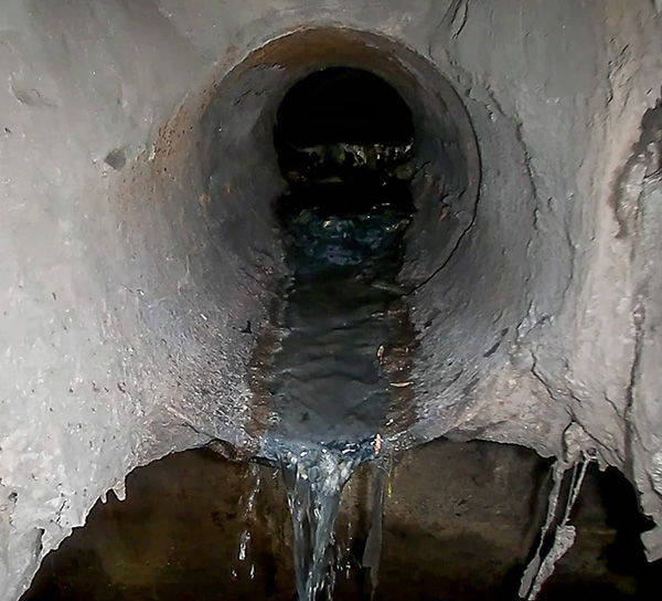 Still from video shows the combined sewer spilling into the storm sewer installed in the Burlington Street, Upper Wentworth Street community.