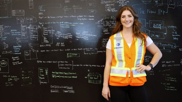 An EllisDon employee models a new safety vest designed for female and gender-noncomforming workers at the firm’s Mississauga head office.