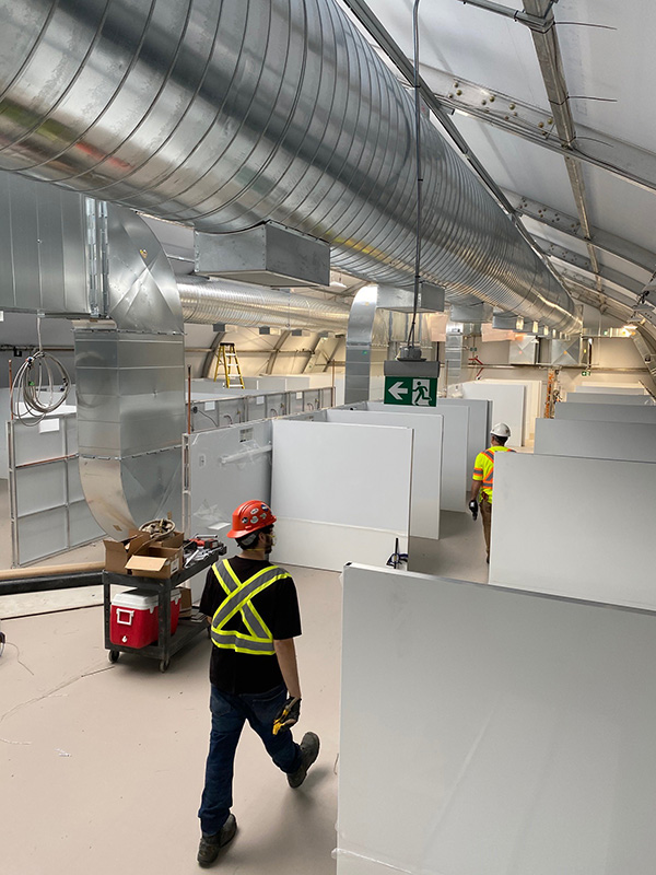 Workers inside the temporary facility for COVID-19 patients at the Joseph Brant Hospital in Burlington, Ont.
