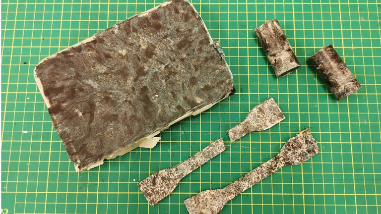 At the University of Regina, Dr. Denise Stilling and a team of graduate students are turning old COVID-19 face masks into various manufacturing and building materials by combining them with things like old tires and sand. This sample block could be used as a paving stone.