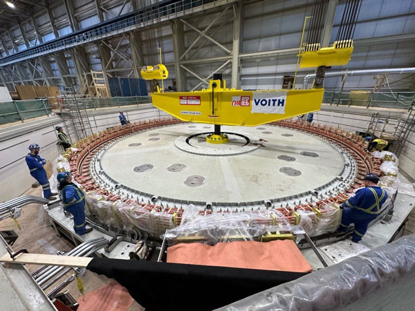 The first turbine is placed into the generator pit inside the powerhouse in February. The turbines were built by Voith Hydro Inc. as part of a $470 million contract and shipped to B.C. from Brazil via the Panama Canal.