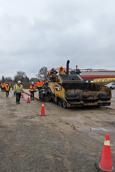 The paving component of the Conestoga program is taught by faculty member Reg Legere, the program co-ordinator of the college’s heavy duty equipment technician program. A former member of the roadbuilding industry, Legere is “well connected” with members of the OAPC. Because it’s not paving weather yet the students used sand instead of asphalt to showcase their skills.