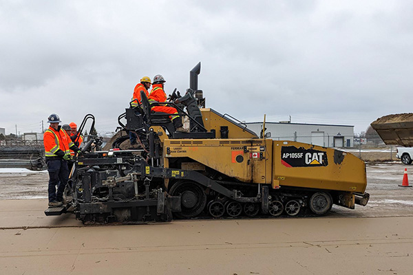 Because it’s not paving weather yet the students used sand instead of asphalt to showcase their skills.