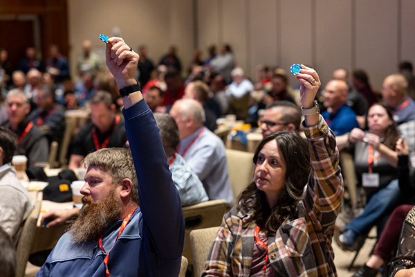 An action plan by four U.S. construction contractor associations has resulted in the release of 50,000 988 awareness chips. Pictured, delegates discussed the program at the MCAA safety conference held in San Diego in January.