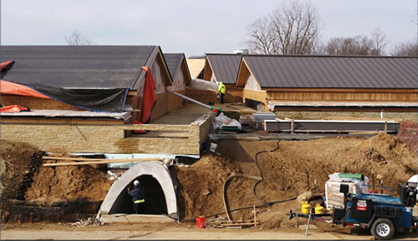 Pictured are JST test labs partly buried in soil for insulation.