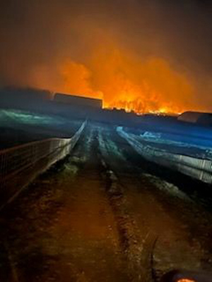 The Alberta wildfires near heavy duty equipment mechanic Clayton Clark’s stepfather’s home light up the night sky. Clark worked in 30-hour shifts for days to keep the flames at bay.