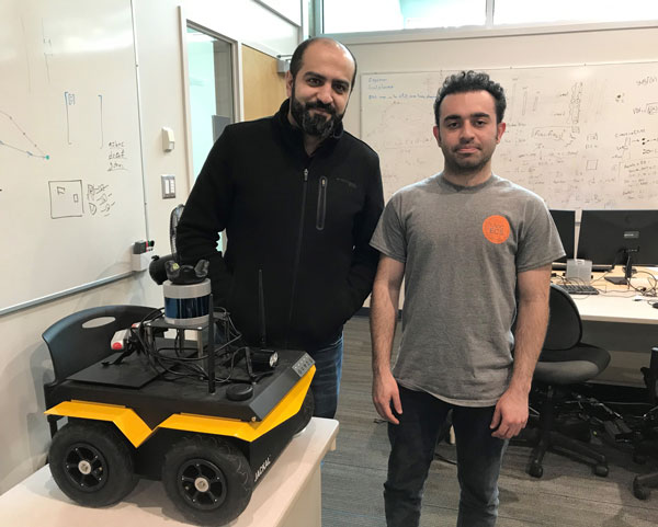 Younes Al-Youne, PhD, and computer engineer Navid Mahdian with the tricked-out Jackal they are teaching at the University of Victoria.