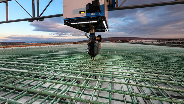 Here is a close-up view of TyBOT automatically tying rebar. TyBOT ties reinforcing steel at a rate of over 1,100 ties per hour.