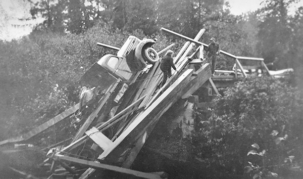 A truck hauling a mine hoist went through the Aidie Creek Bridge on old Ferguson Highway (Highway 11) 10 kilometres north of Englehart, Ont. Lawrence Kruger collection.