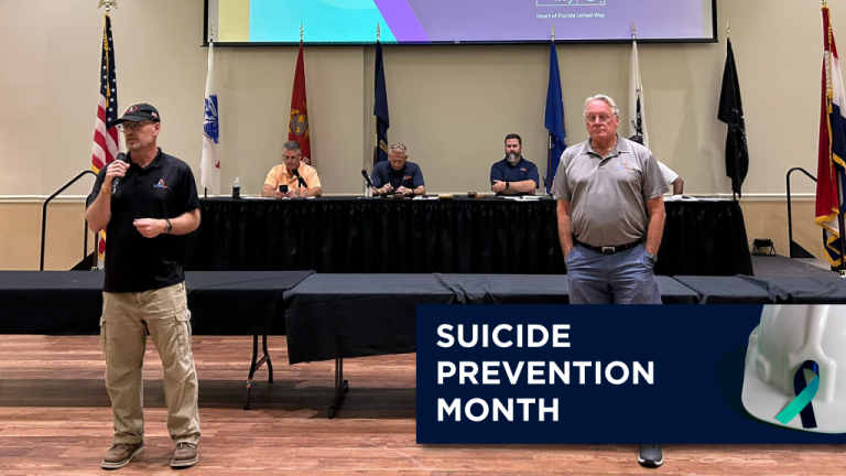 Getting the message: James Pursell and Don Willey (right) addressed LIUNA Local 110 members about the LEAN program during September’s union meeting.