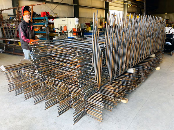 During the pandemic in 2020, Kit Steel broke ground on a new 13,000-square-foot rebar fabrication facility. Shown is Wayne Boyer with some fabricated rebar.