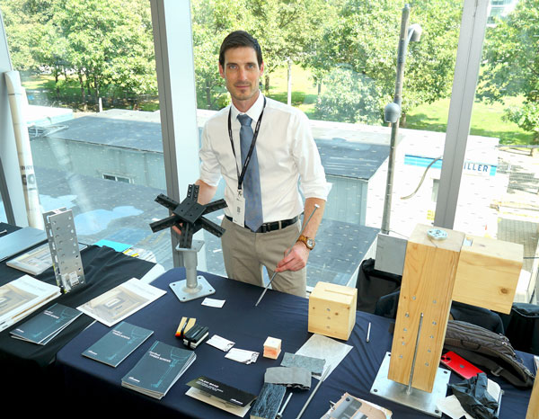 Francois-Laurent Chabot of Rothoblaas Canada displays a replica of the company’s Spider connector which allows the construction of multi-storey mass timber buildings with column-to-floor structures in which columns are between six-feet and 19.5 feet apart. The demonstration was part of the Mass Timber Seminar conference held recently at George Brown College’s waterfront campus in Toronto.