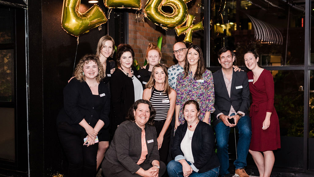 Members of the ZEIC team gather for a group photo at the ZEBX fifth anniversary event in Vancouver. Left to right back row: Anna Henderson, Sarah Lusina, Nadine Jarry, Natalie Douglas, Kim McClymont, Roberto Pecora, Mariko Michasiw, Gordon Patrick Newell, Caroline Butchart. Left to right front: Melina Scholefield, Darla Simpson.