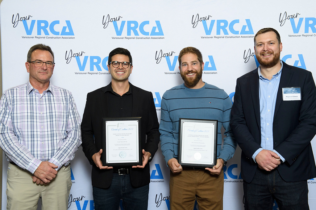 Winners in the Trade and General Contractors category show their awards for work on the revamped Apple Store in Pacific Centre in downtown Vancouver.