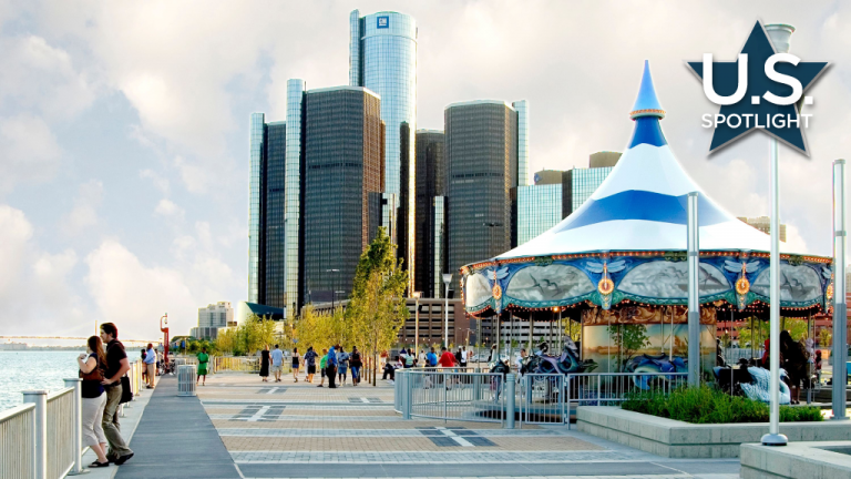 Shown is the Detroit River shoreline with the Renaissance Center towers in background before and after the RiverWalk