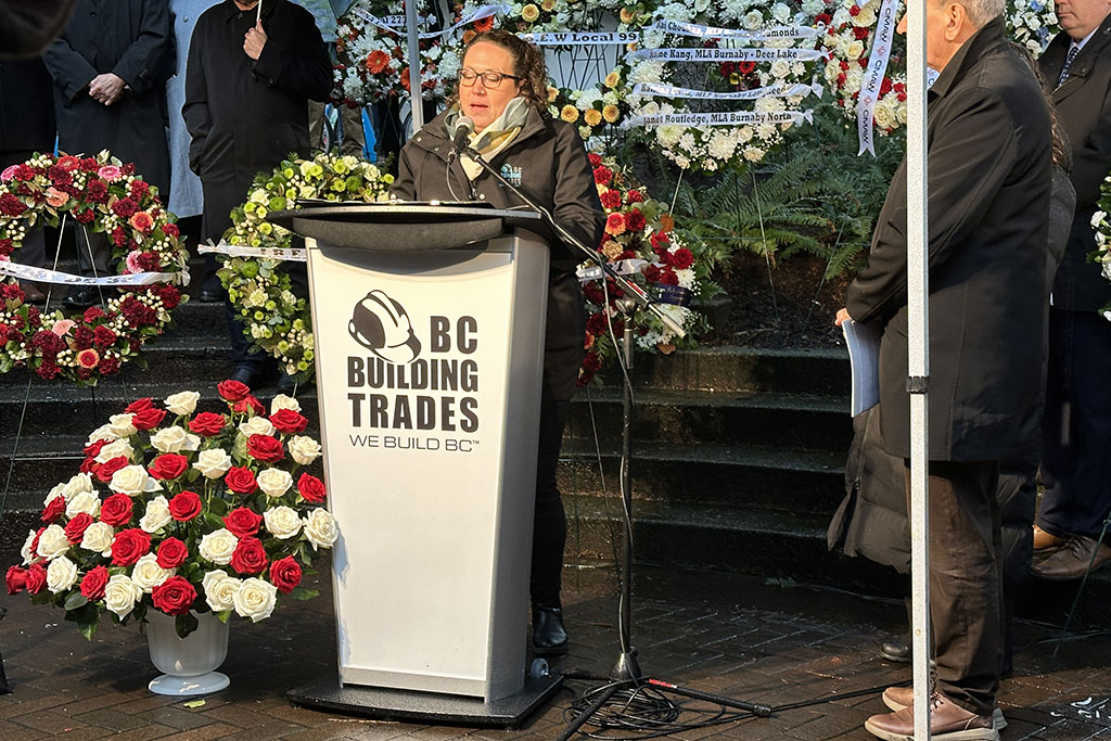 BC Building Trades executive director Brynn Bourke hosted the 43rd annual memorial Jan. 5 to the four workers killed on Jan. 7, 1981 when they fell off a collapsed fly form attached to the Bentall IV building in downtown Vancouver. To her bottom left is a flower arrangement symbolizing all the construction workers killed on the job in 2022, a record of 54 individuals from exposure and trauma.
