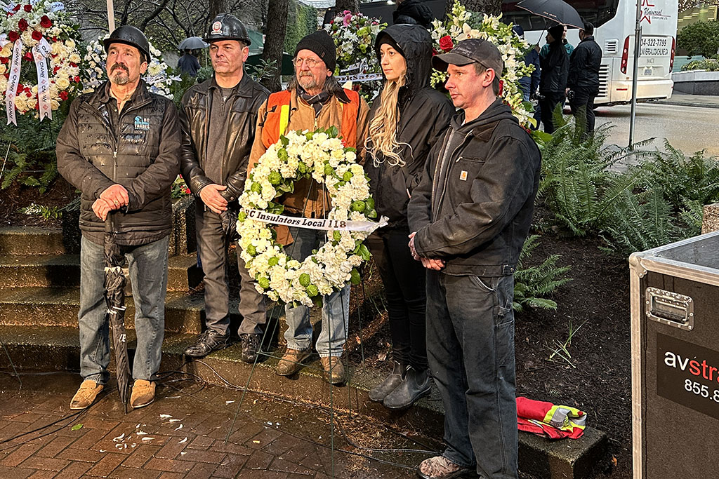 Former BC Building Trades leader and long-time asbestos reform advocate Lee Loftus poses with fellow tradespeople at the Bentall IV memorial on Jan 5.