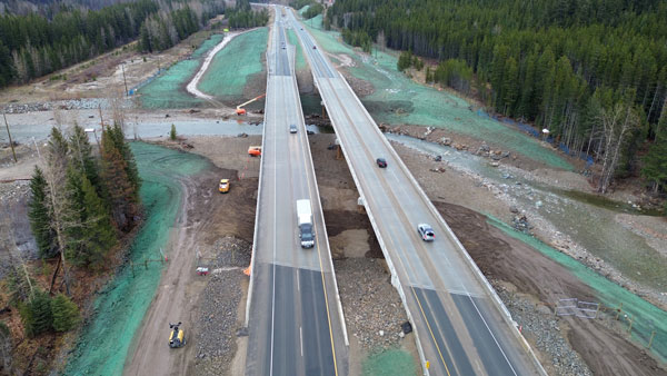 After flooding washed out key B.C. highways in 2021, the Coquihalla Highway was partially reopened to commercial traffic after only 35 days. Pictured, permanent repairs to the highway including work on climate-resilient bridges were completed last November.