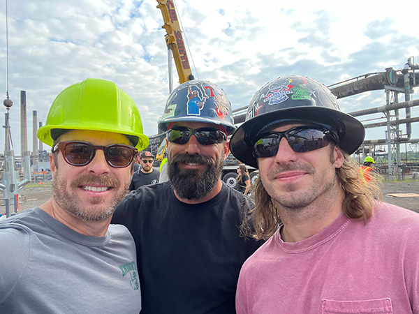 Creator, writer and executive producer Ryan Lindsay (left) with his brothers Tyson and Kellan on the set of The Trades in Hamilton, Ont. The brothers, who work in the trades, were brought on as consultants.