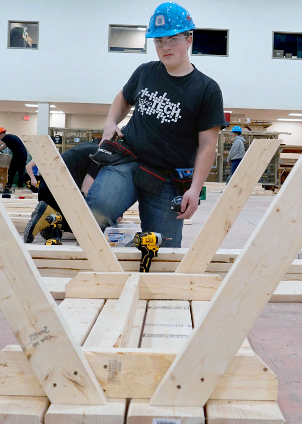 Catholic high school student Paulo DiCarlo works away at his project during the competition at the CCAT.