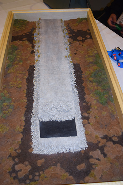A model presented at the recent prospectors conference shows how the northern all-season road will be “floating” on top of muskeg, with a layer of load-bearing geotextile material that can hold the rock and gravel forming the road surface.