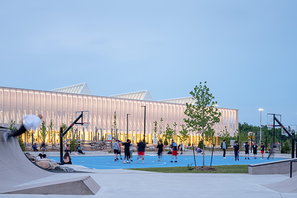 Churchill Meadows Community Centre and Sports Park in Mississauga, Ont. turned a 50-acre site into richly textured parkland, with a 74,000-square-foot community centre as its focus. The canopy that runs along the facades makes visible the building’s mass timber structure, which is an array of glulam columns that provide structural and curtainwall framing, states the OAA.