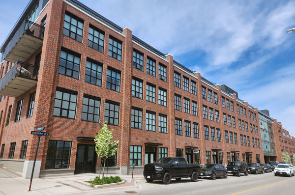 The mixed-used Matchedash Lofts development occupies a full downtown block in the mid-Ontario city of Orillia.