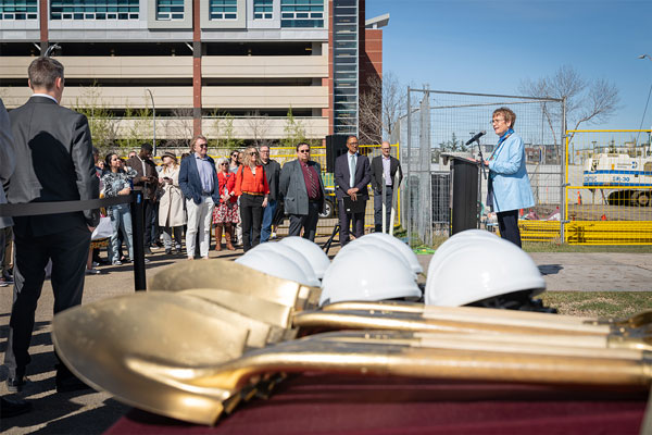 Dr. Annette Trimbee, president and vice-chancellor of MacEwan University, addresses the audience at a groundbreaking ceremony May 9.
