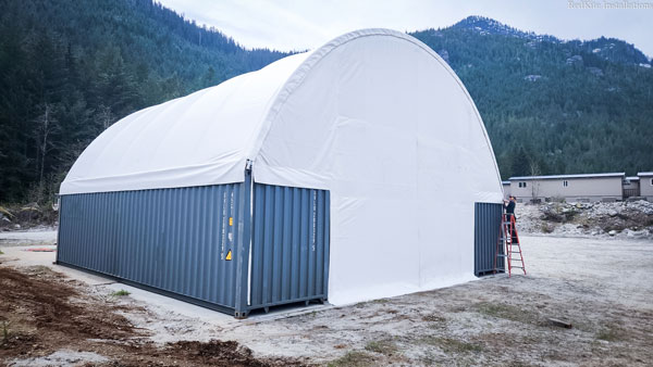 Stabl Shelters poly vinyl coated fabric covers also provide a back wall and a front with a garage door entrance for a fully-enclosed shelter.