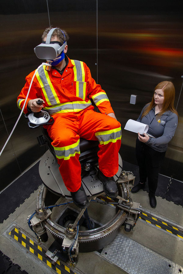 A researcher monitors a subject in the CROSH environmental simulator at Laurentian University in Sudbury, Ont. CROSH released a new heat-stress toolkit for outdoor workers in May.