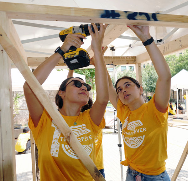 Ari Golmakani (left) and Emily Paiva participate in the TimberFever competition.