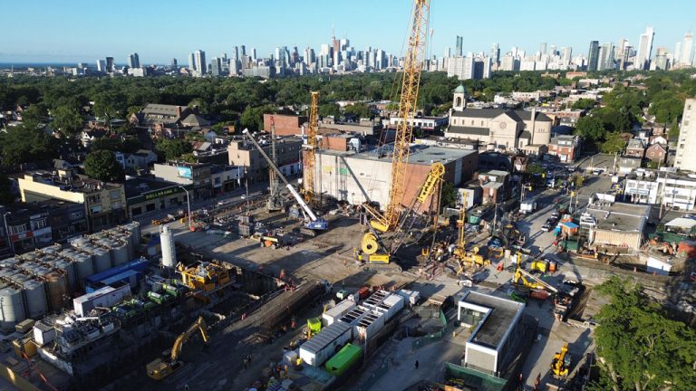 Panellists at the recent GTHA Transit Summit hosted by Transport Futures documented the rise in costs of major Canadian transit projects in recent years. Pictured, crews recently worked to install foundational supports at the Pape Station site on the Ontario Place line across Toronto.