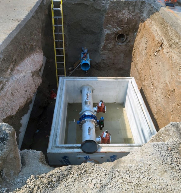 Shown is the installation of a valve chamber near Greenlane Road.