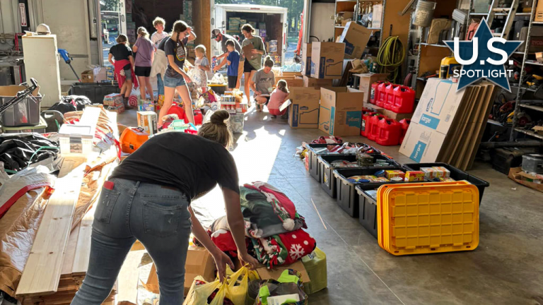 Volunteers from Yoder Construction prepare some of the donations earmarked for North Carolina.