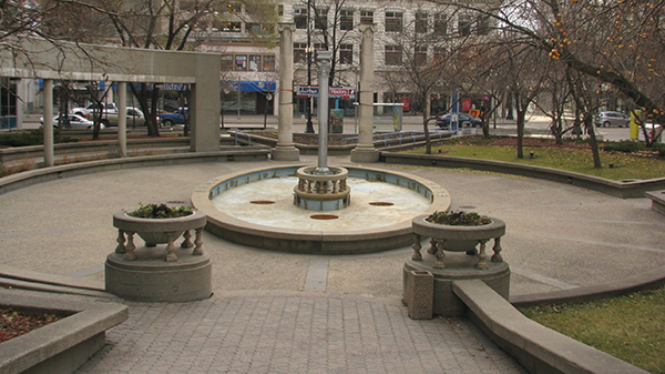 When the park was built in 1985, it incorporated remnants of old downtown buildings that had been demolished. They included two stone columns from the Northern Crown Bank, stone balustrades from the Devon Court Apartments and a silver cast-iron column from the McIntyre Block.