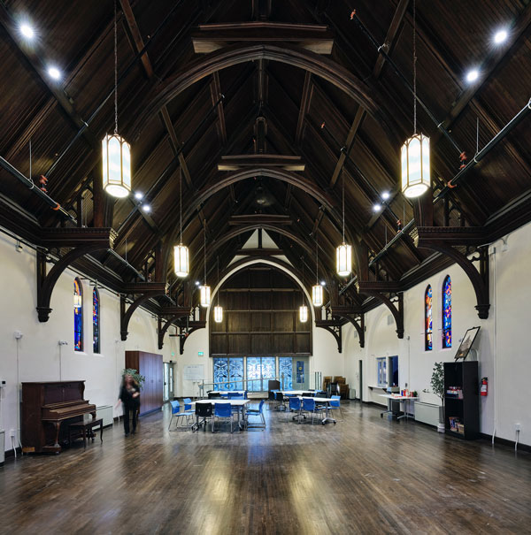 St. Mark’s Place is a supportive housing facility owned and operated by Indwell. The church interior including the hammer beam ceiling and stained-glass windows. The facility has been built to Passive House standards.