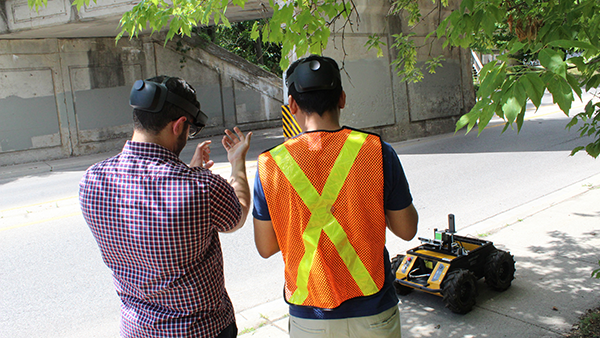 As part of the Smart Infrastructure Metaverse system, data is gathered by a robot and processed for analysis by two sets of teams in different locations. Pictured is a Kitchener bridge site.