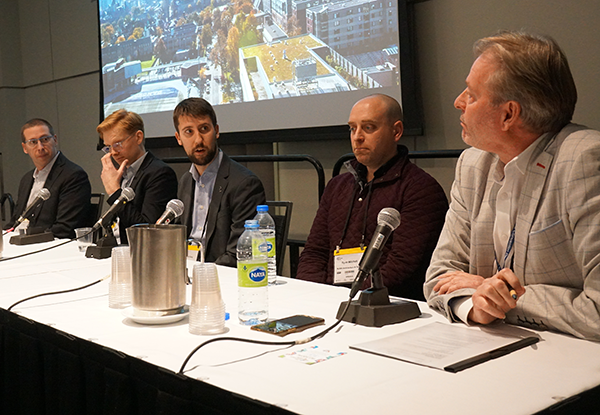 Ryan Going (centre), a project manager with Pomerleau, addresses Mike Yorke (right) about construction challenges at the University of Toronto’s Academic Wood Tower, which is currently under construction.