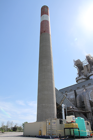 The CO2 emissions captured from the cement plant’s stack are used in the creation of sustainable products such as low-carbon concrete. The carbon is captured with an external scrubber and diverted into a patented recycling system container provided by Hyperion.