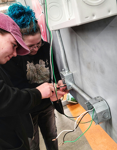 Launched in 2024, the BTS program offers hands-on workshops in high-demand trades such as electrical, mechanical, carpentry, roofing, heavy equipment operation, virtual welding, and masonry.