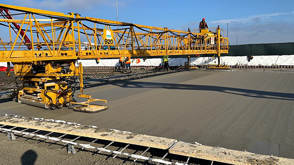 A specialized concrete screed machine ensures the concrete is poured with precision, creating the perfect thickness, slope and curvature.