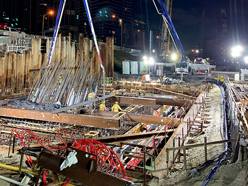 Upon completion, the bridge will span 1,025 feet across two busy roadways. The largest arch will soar 325 feet above ground and measure 650 feet across. Approximately 5,000 cubic yards of concrete and 1.7 million pounds of steel reinforcing will be used for the centre pier footing. Shown is one concrete pour.