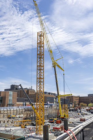 A mobile crane is used to build a tower crane at the site of the QEII Halifax Infirmary expansion project.