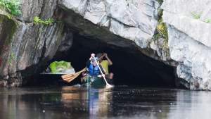 Creativity with a backhoe clears fallen rocks from tourist-destination tunnel