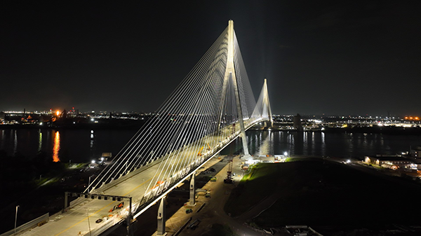 1. This photo shows the Gordie Howe International Bridge lit at night.
