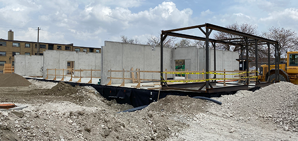 Crews have been able to significantly accelerate the construction timeline for the structure because onsite work such as excavating, installing the concrete slab and installation of a steel podium were able to proceed while modules for housing were manufactured off-site in a factory.