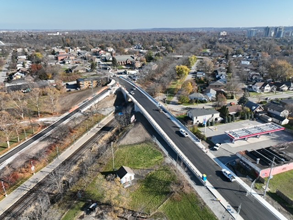 Some of the work included demolition of the existing bridge during railway track blocks, construction of eight-metre-tall abutments and a reinforced concrete deck overlay was placed on the girders followed by concrete parapet walls on either side of the roadway.